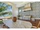 Stainless steel grill, custom cabinetry, and ocean views at 121 Seagull Ln, Sarasota, FL 34236