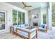 Relaxing outdoor patio with fireplace and comfortable seating, overlooking the pool at 121 Seagull Ln, Sarasota, FL 34236