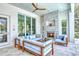 Cozy patio with a fireplace and comfortable seating at 121 Seagull Ln, Sarasota, FL 34236