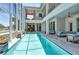 Enclosed pool and patio area with seating and stunning water views at 121 Seagull Ln, Sarasota, FL 34236