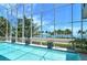 Enclosed pool with stunning water views, and a patio at 121 Seagull Ln, Sarasota, FL 34236