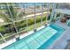 Expansive pool with a screened enclosure and ocean view at 121 Seagull Ln, Sarasota, FL 34236