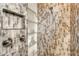 Walk-in shower with mosaic tile and double shower heads at 121 Seagull Ln, Sarasota, FL 34236