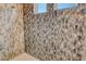 Walk-in shower with mosaic tile and rainfall shower head at 121 Seagull Ln, Sarasota, FL 34236