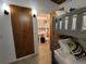 Bright bedroom featuring a bunk bed and attached bathroom with pedestal sink and tile shower at 8010 Marina Dr, Holmes Beach, FL 34217