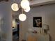 Hallway with modern lighting fixture leading to bedroom at 8010 Marina Dr, Holmes Beach, FL 34217