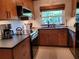 Modern kitchen featuring stainless steel appliances, sleek countertops, and ample cabinet space at 8010 Marina Dr, Holmes Beach, FL 34217