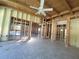 Spacious living room showcasing exposed framing, offering a glimpse into the renovation potential at 8010 Marina Dr, Holmes Beach, FL 34217