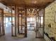 Renovation-in-progress living room featuring exposed framing and spacious layout, ready for transformation at 8010 Marina Dr, Holmes Beach, FL 34217