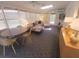 Bright sunroom with a couch, chairs, and a table with lots of natural light at 8010 Marina Dr, Holmes Beach, FL 34217