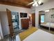 Bright bedroom with a queen bed and access to the bathroom at 8010 Marina Dr, Holmes Beach, FL 34217