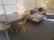 Open living area with a sectional sofa and dining area at 8010 Marina Dr, Holmes Beach, FL 34217