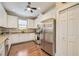 Spacious kitchen with white cabinets, granite counters, and stainless steel appliances at 13202 Torresina Ter, Bradenton, FL 34211