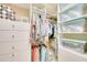 Well-organized closet with ample hanging and shelving space at 13202 Torresina Ter, Bradenton, FL 34211