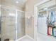 Bathroom with shower, large closet, and neutral color palette at 13202 Torresina Ter, Bradenton, FL 34211