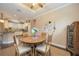 Charming dining room with a wooden table and kitchen view at 13202 Torresina Ter, Bradenton, FL 34211