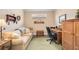Home office with built-in shelving, comfortable seating, and ample workspace at 13202 Torresina Ter, Bradenton, FL 34211