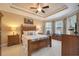 Spacious bedroom with a wooden bed frame and ample natural light at 13202 Torresina Ter, Bradenton, FL 34211