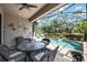 Relaxing screened-in pool area with patio furniture at 13202 Torresina Ter, Bradenton, FL 34211