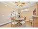 Dining room features a round table, four chairs and hardwood floors at 13202 Torresina Ter, Bradenton, FL 34211