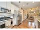 Modern kitchen with stainless steel appliances and white shaker cabinets at 13202 Torresina Ter, Bradenton, FL 34211