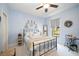 Charming bedroom with a metal bed frame and light blue walls at 13202 Torresina Ter, Bradenton, FL 34211
