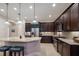Elegant kitchen with dark wood cabinets, granite countertops, and stainless steel appliances at 5209 Lake Overlook Ave, Bradenton, FL 34208