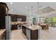 Open concept kitchen with island and stainless steel appliances at 5209 Lake Overlook Ave, Bradenton, FL 34208
