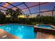 Relaxing screened pool and spa, perfect for sunset enjoyment at 5209 Lake Overlook Ave, Bradenton, FL 34208