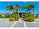 Community clubhouse with palm trees and ample parking at 5209 Lake Overlook Ave, Bradenton, FL 34208