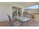 Outdoor kitchen with built-in grill and dining area at 5209 Lake Overlook Ave, Bradenton, FL 34208