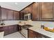 Bright kitchen with granite countertops and stainless steel appliances at 5209 Lake Overlook Ave, Bradenton, FL 34208