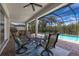 Enjoy this refreshing pool area with seating and screened enclosure at 5209 Lake Overlook Ave, Bradenton, FL 34208