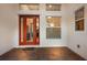 Orange door leads to interior with glass panels at 5209 Lake Overlook Ave, Bradenton, FL 34208