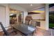 Covered patio with seating area, outdoor kitchen, and view of sunset at 5209 Lake Overlook Ave, Bradenton, FL 34208