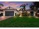 Two-car garage, well-manicured lawn, and appealing facade at 5209 Lake Overlook Ave, Bradenton, FL 34208