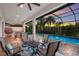 Relaxing pool and patio area with seating and sunset view at 5209 Lake Overlook Ave, Bradenton, FL 34208