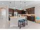 Kitchen boasts granite countertops, stainless steel appliances, and dark wood cabinetry at 5209 Lake Overlook Ave, Bradenton, FL 34208