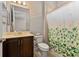 Clean bathroom with shower/tub combo and patterned shower curtain at 5209 Lake Overlook Ave, Bradenton, FL 34208