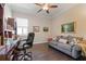 Office with hardwood floors, desk, chair, and sofa at 5209 Lake Overlook Ave, Bradenton, FL 34208