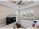 Bright bedroom with king bed, dresser, and plantation shutters at 5209 Lake Overlook Ave, Bradenton, FL 34208