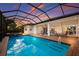 Large pool and spa with screened enclosure and sunset views at 5209 Lake Overlook Ave, Bradenton, FL 34208