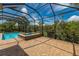 Inviting pool and spa area with screened enclosure at 5209 Lake Overlook Ave, Bradenton, FL 34208