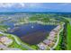 Aerial view of upscale waterfront community with lake, marina, and homes at 5209 Lake Overlook Ave, Bradenton, FL 34208