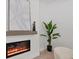 Modern linear fireplace with gray mantel and stylish decor at 201 S Shade Ave, Sarasota, FL 34237