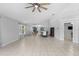 Bright, open-concept living and dining area features tile floors and neutral paint at 7416 41St E Ave, Bradenton, FL 34208