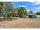 Outbuildings on a large lot with shade trees at 7416 41St E Ave, Bradenton, FL 34208