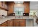 Stylish kitchen featuring granite counters, stainless steel appliances, and a functional layout at 808 Ponderosa Pine Ln, Sarasota, FL 34243