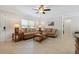 Spacious living room with a sofa, coffee table, and ample natural light at 808 Ponderosa Pine Ln, Sarasota, FL 34243