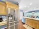 Modern kitchen with stainless steel refrigerator and island at 219 81St St, Holmes Beach, FL 34217